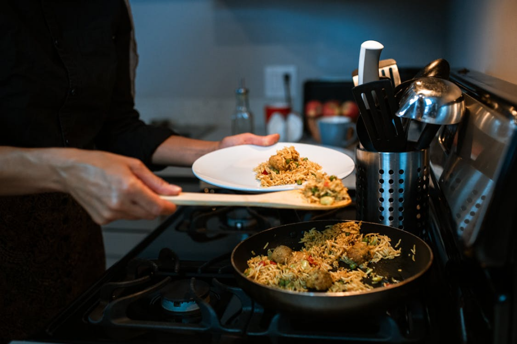 person plating a skillet meal to turn leftovers into new meals