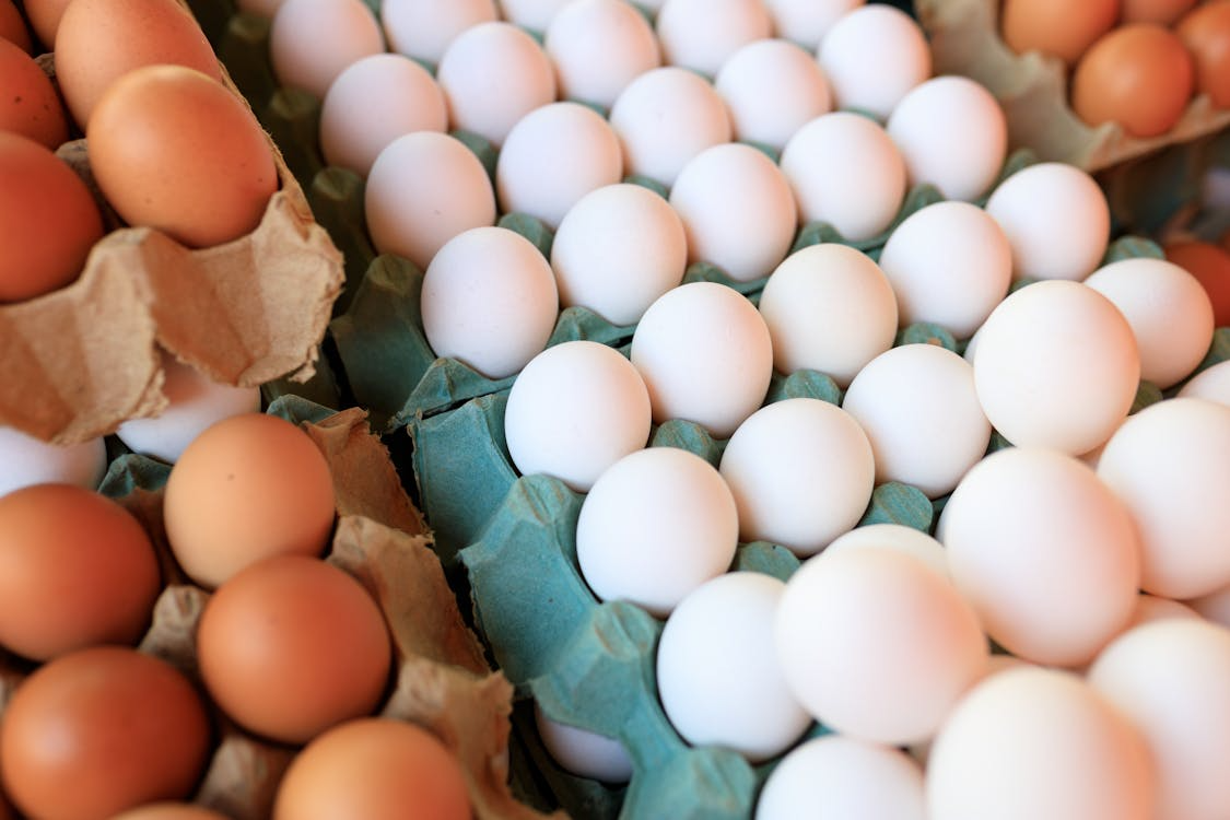 cartons of eggs showing budget proteins to stock up on for affordable weekly meals
